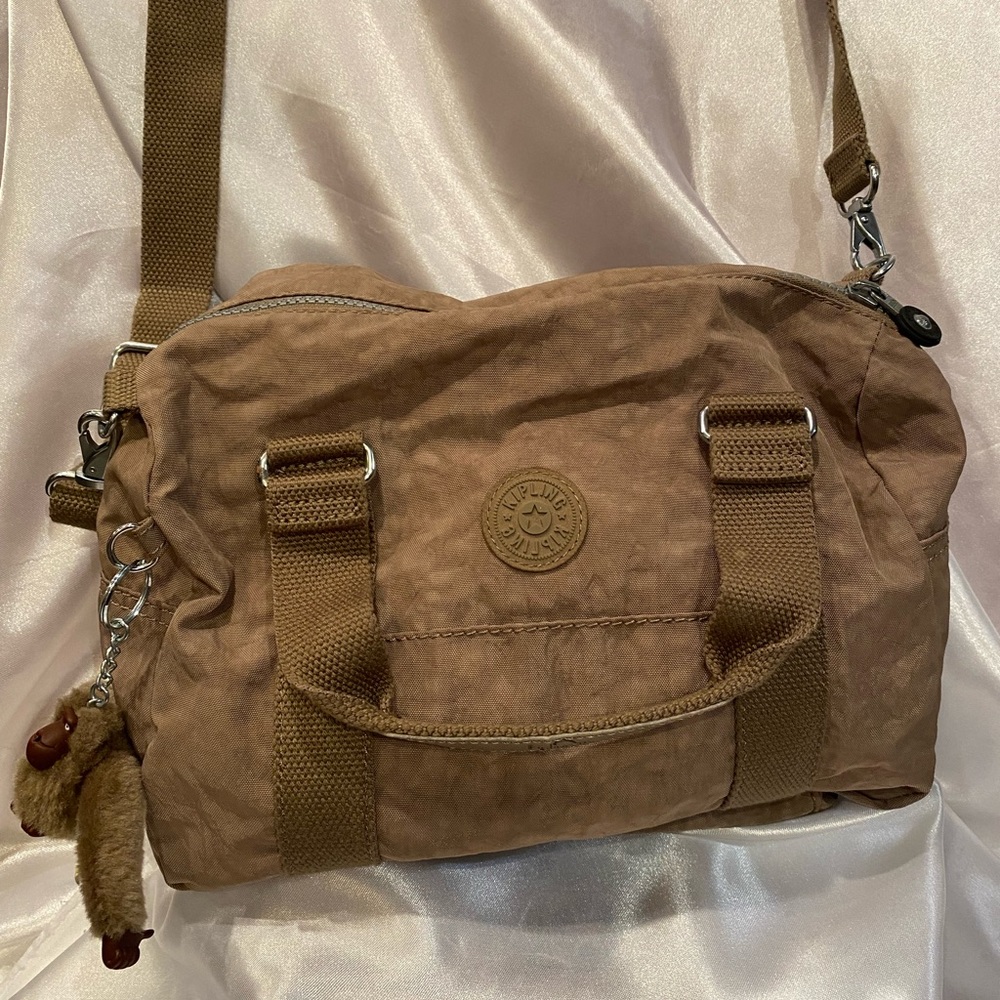 Kipling Crossbody Bag. Made from durable fabric,lightweight,adjustable strap.